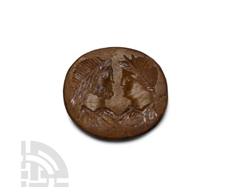 4th century A.D. A brown oval intaglio with two facing male busts, both diademed and togate, the left bust bearded, possibly 