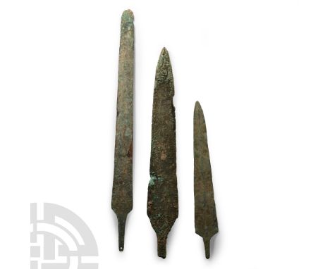 2nd millennium B.C. With a narrow pointed blade and wide shallow raised flange to the centre, straight sides, well marked sho