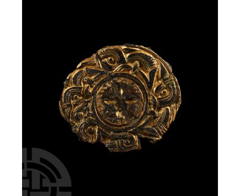 Circa 6th century A.D. Discoid with central tondo decorated with four impressed lentoids and surrounding pellet band, rim of 