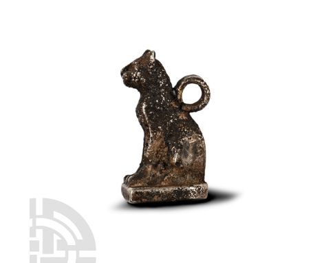 Late-Ptolemaic Period, 664-30 B.C. Modelled seated on a tongue-shaped base, with suspension loop to the back. Cf. Andrews, C.