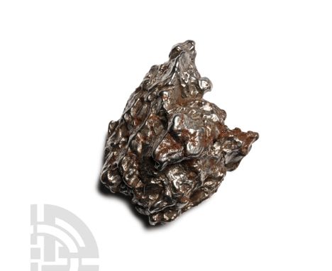 Fell 6000-5000 years B.P. A nickel-iron meteorite (IAB).  76.6 grams, 49 mm (2 in.). [No Reserve] From a Lincolnshire, UK, co