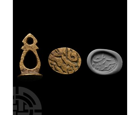 17th-18th century A.D. With ellipsoid body bearing incised Nastaliq(?) inscription, openwork stem and suspension loop to the 