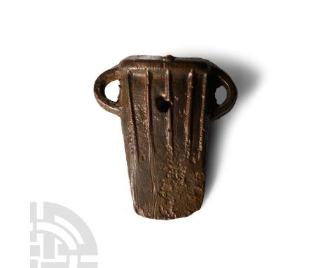 10th-9th century B.C. With rectangular-section mouth, integral collar developing to five vertical ribs on each broad face, tw