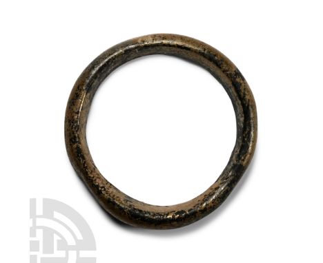 Circa 4th century A.D. D-shaped in section, annular in plan, some iridescence remaining.  40.6 grams, 79 mm (3 1/8 in.). [No 