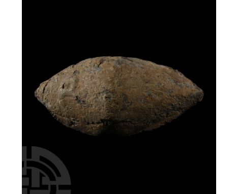 45 B.C. A biconical facetted lentoid-section lead sling shot (glans), inscription monogram a combination of letters 'C', 'A' 