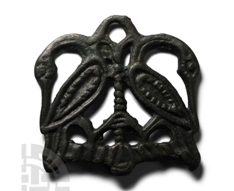 9th-11th century A.D. Openwork bifacial handle from a firesteel formed as two swans with recurved necks flanking a ropework c