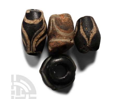 Circa 5th-7th century A.D. Including fusiform types with marvered trails and other types.  26.6 grams total, 20-27 mm (3/4 - 