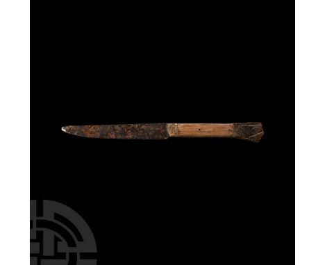 15th-16th century A.D. Comprising a single cutting edge and scale tang; bifacial pommel engraved with a female figure to one 