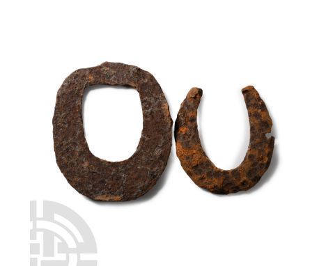 14th-16th century A.D. One crescentic with flanges to ends, the other a hoop.  850 grams total, 12.7-16 cm (5 - 6 1/4 in.). [