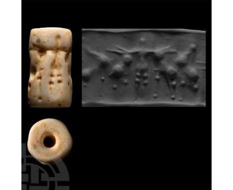 2400-2200 B.C. Cylinder with cord and bead handles; accompanied by a copy of an old scholarly note, typed and signed by W.G. 