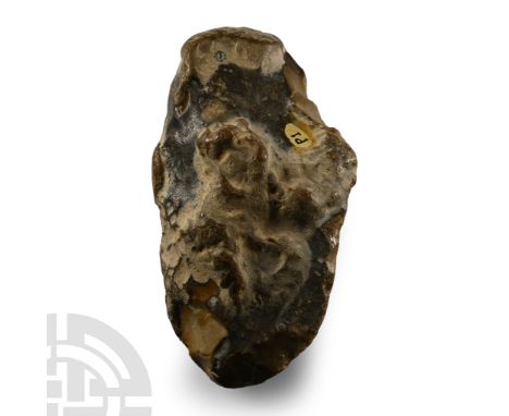 Lower Palaeolithic Period, 450,000-280,000 B.P. Large rough water-worn handaxe showing some advanced features: a cambered edg