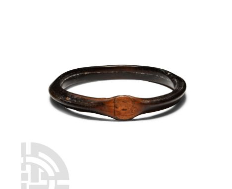 3rd-2nd century B.C. D-section bangle with one flat panel at juncture. Cf. fragment of a similar item in the British Museum u