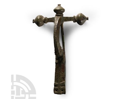 4th century A.D. With onion knop finials, deep bow, stepped junction with foot, trapezoidal foot with ring-and-dot motifs and