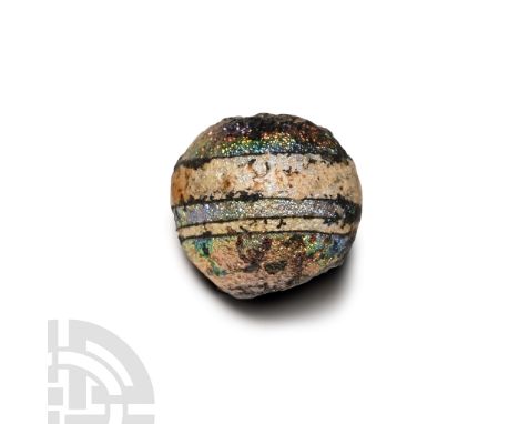2nd-3rd century A.D. Sphere with circumferential banding, iridescent surface.  3.38 grams, 14 mm (1/2 in.). [No Reserve] From