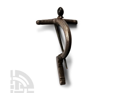 3rd century A.D. Of early type with lemon-shaped knop above the round-section crossbar, facetted bow with filigree coils to t