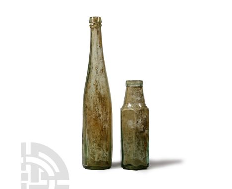 29 March 1879 A.D. Aqua glass bottle with pontil base, ten-sided body, narrow neck hexagonal-section bottle with broad mouth.