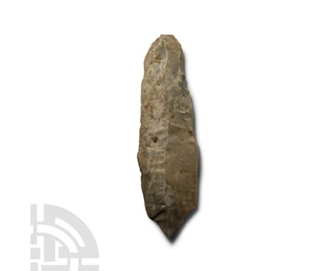 Neolithic Period, circa 6000 B.P. Triangular in section with narrow butt and irregular cutting edge.  127 grams, 16.8 cm (6 5