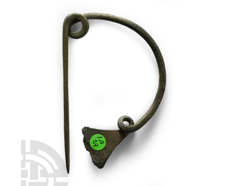Early Iron Age, 8th century B.C. Single-piece fibula comprising a curved bow with integral coiled spring to one end developin