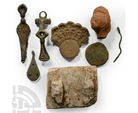 1st-4th century A.D. Including a portion of dressed marble block, a bow brooch, an unfinished nail-cleaner and other items.  