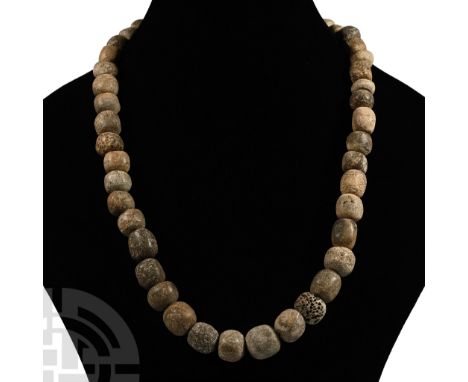 Pleistocene Period, 2.6 million-11,700 years B.P. Restrung using recently polished Mammuthus primigenius bone beads. See Guid