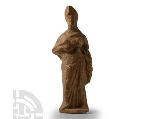 4th-3rd century B.C. Tanagra type, hollow-formed with a void to the reverse, standing female in tiered robe wearing a diadem 