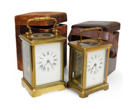 A brass cased carriage clock together with a similar timepiece, both with cases, one with key. Condition - fair, untested