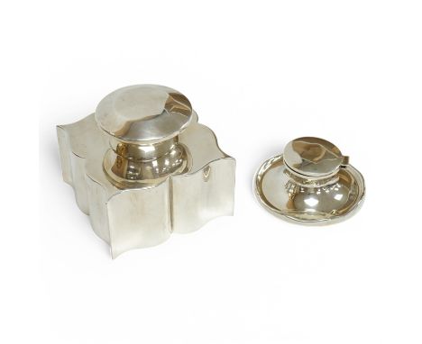 A late Victorian silver serpentine form inkwell(lacking insert), by Hukin &amp; Heath, Birmingham, 1899, width 10cm, together