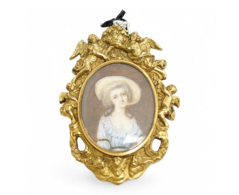 Georgian School, Portrait miniature on ivory, Lady wearing Regency dress, signed ‘Hall’, housed in an ormolu frame, overall 1