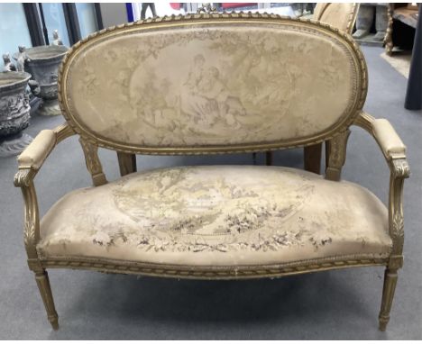 A Louis XVI style giltwood and composition three piece salon suite with tapestry upholstery, settee width 120cm, depth 54cm, 