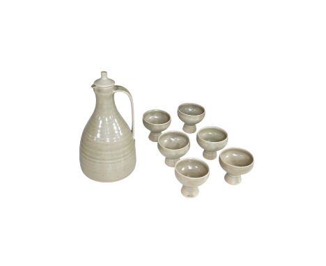 A David Leach St Ives pottery celadon glazed sake set comprising baluster lidded decanter and six stem cups, largest 23cm hig