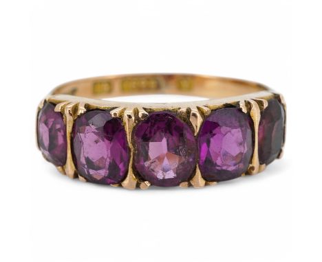 A five-stone garnet ring, early 20th century, set with five cushion-shaped garnets, mounted in 15ct gold, size K1/2, gross we