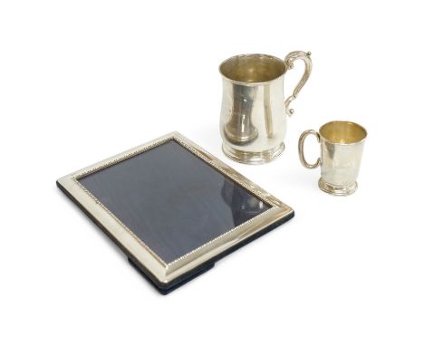 A George V silver baluster mug, by William Hutton &amp; Sons, Birmingham, 1927, 11.8cm, a small George V silver mug and a mod