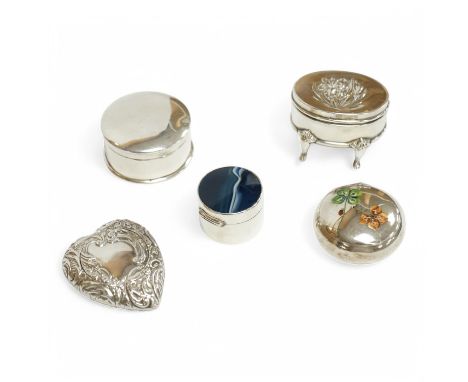 Four assorted early 20th century silver or white metal pill boxes, including repousse heart shape by Joseph Gloster Ltd, Birm