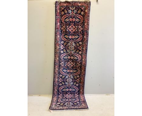A North West Persian blue ground runner, 284cm x 80cm. Condition - fair
