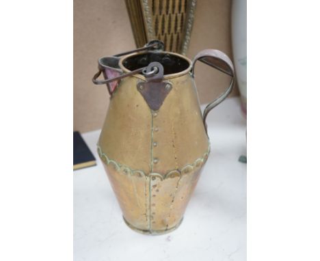 A brass fan shaped fireguard, a riveted jug and four footed planter.  Fan shaped fire guard 63cm high. Condition -  poor to f