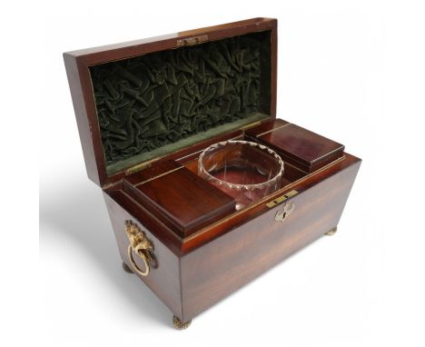A Regency mahogany sarcophagus tea caddy with glass bowl and gilt metal handles. Condition - good