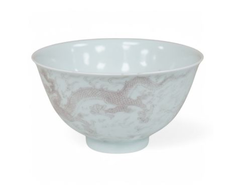 A Chinese underglaze copper red ‘dragon' bowl, Kangxi mark to base but later, 11cm diameter. Condition - good Structurally go