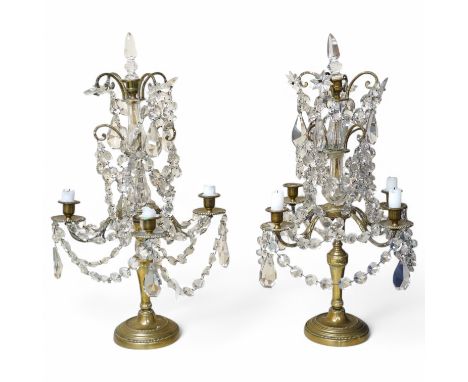 A pair of brass four branch candelabra with glass drops, 61cm high. Condition - fair