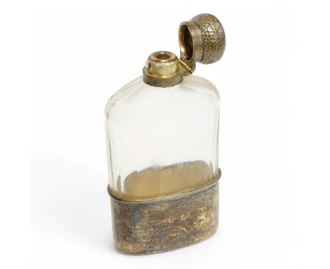 An Edwardian silver mounted glass hip flask, the planished cap with engraved monogram, Percy Whitehouse, London 1906, 15.1cm.