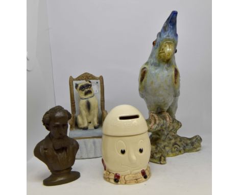 Assorted ceramic pieces including; Sylvac egg separator pot, Charles Dickens bust model, pug dog statue on chair and cockatoo