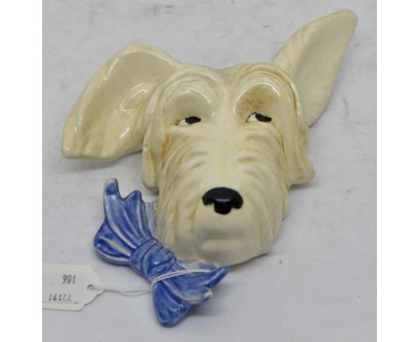 Beswick Sealyham wall plaque; number 373, bow on left, white dog with blue bow