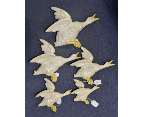 Beswick Mallard wall plaques; numbers 596-0, 596-1, 596-2, 596-3, 596-4, white with yellow beaks, matte (5) No obvious signs 