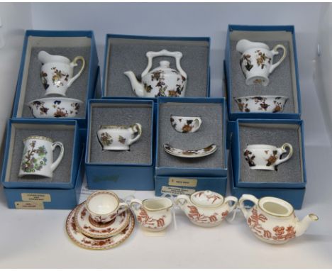 Coalport miniatures to include Red Willow teapot, milk and sugar, Indian Tree trio, kettle, pitcher and basin, jug, cup and s