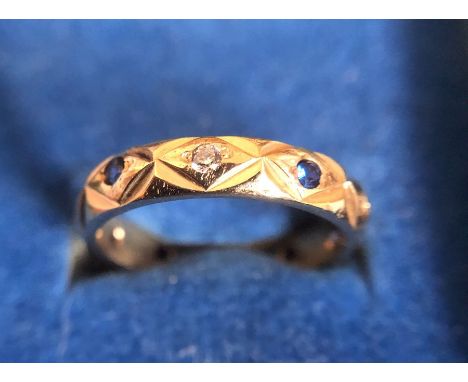 A 9ct gold ring set with blue and white stones. 2.7gms total weight. Size K. 