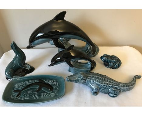 Poole pottery dolphins, seal, frog, crocodile and dolphin dish.Condition ReportAll good condition with no noticeable faults t