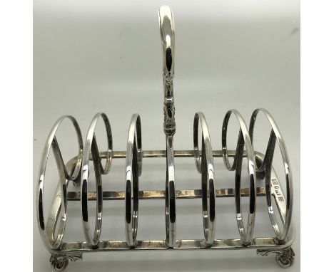 A William IV silver toast rack, Sheffield 1834, maker Henry Wilkinson & Co. 287.5gms.There is some bend to the base platform 