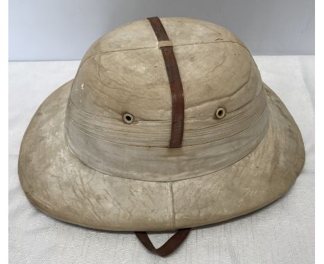 Pith helmet made in India, K Challaram and Sons, small size, broken peak, inside measures 19 x 16cms. 