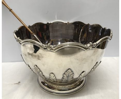 Hallmarked silver punch bowl with decorative rim and embossed leaves to side, CJ Vander London 1974-5. 20.5cm h x 31.5cm w. 2