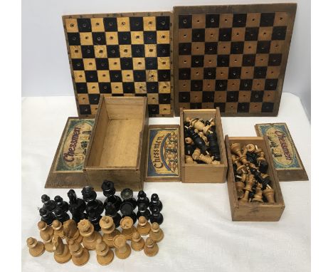 Three wooden chess sets, K and C Ltd in pine boxes with two homemade chess boards with peg holes.