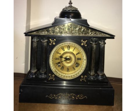 A 19thC black marble mantle clock. 41cms h.